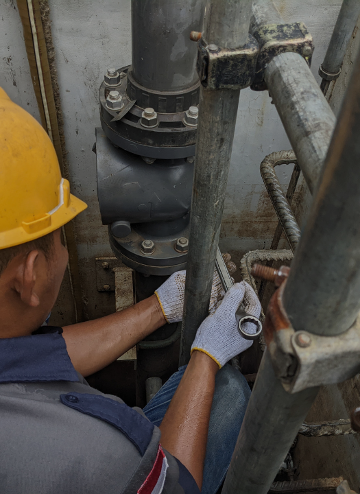 Emergency sewer repair in progress with plumbing tools visible